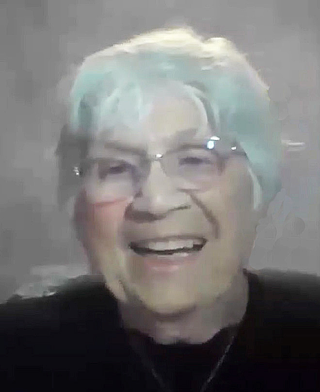 Eileen Sifferman is a white woman with short white hair, smiling while speaking.