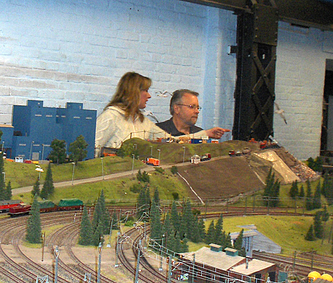 Our private guide, Sonya, stands with Fred behind the layout and points out something to him.