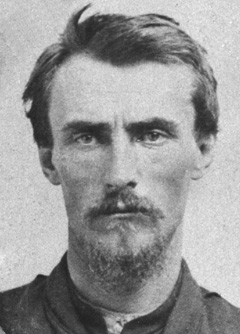photo of Thomas Lucas (from the chest up) shows him looking much thinner and about 10 years older than the previous photo, wearing a soldier's uniform and staring harshly at the camera
