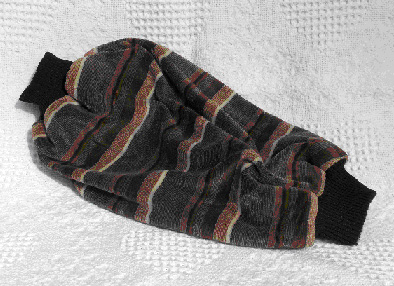 photo shows a mobility muff, which is a tube of fabric about a foot long and half as wide, with cuffs on each end.