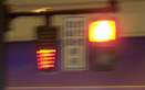 3 photos show closeups of the previous signals, but now the top light on the pedestrian signal is lit and red, and the rectangle in the first photo is filled with red light, the second photo shows it half filled with red light, and the last photo shows it with some red at the bottom of the rectangle.