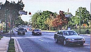 Photo shows a busy 4-lane street with only about 30-40 feet between cars.