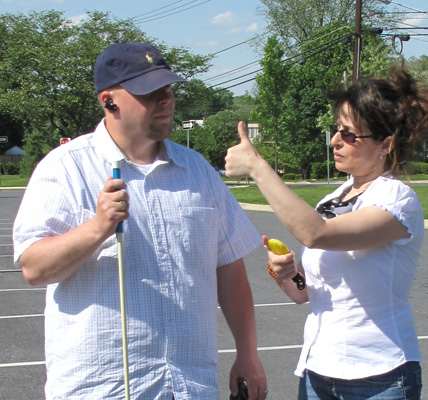 Photo shows Jomania holding her stopwatch and giving Paul a 'thumbs-up.'