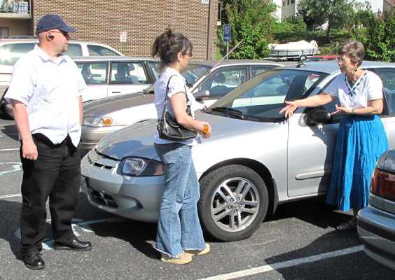 Photo shows Dona showing a car and its mirror to Paul and Jomania.
